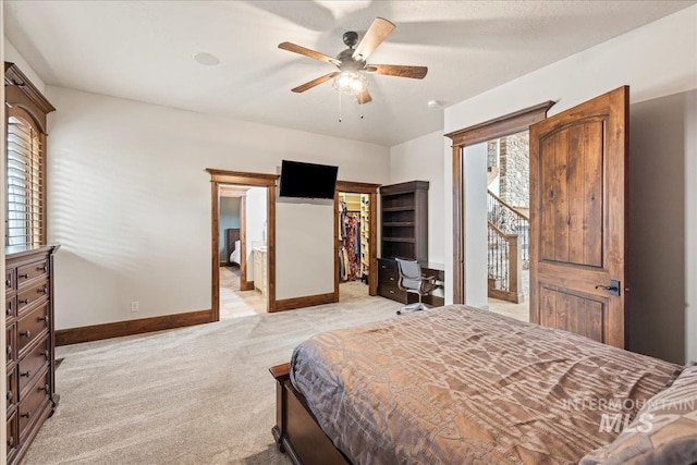 7600 W Ledgerwood Ln, Meridian, ID 83646 - bedroom featuring ceiling fan, a spacious closet, baseboards, and light carpet