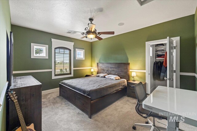7600 W Ledgerwood Ln, Meridian, ID 83646 - bedroom featuring carpet flooring, ceiling fan, a walk in closet, visible vents, and baseboards