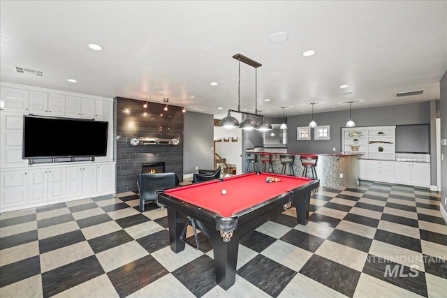 7600 W Ledgerwood Ln, Meridian, ID 83646 - game room featuring a dry bar, a fireplace, visible vents, and recessed lighting