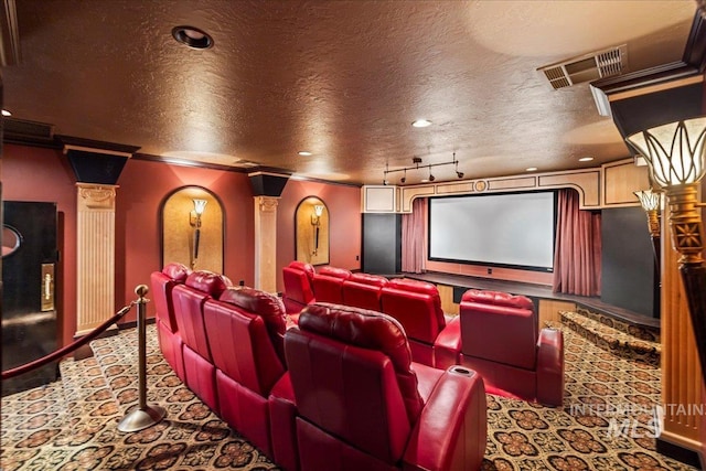 7600 W Ledgerwood Ln, Meridian, ID 83646 - carpeted cinema featuring a textured ceiling, visible vents, baseboards, and decorative columns