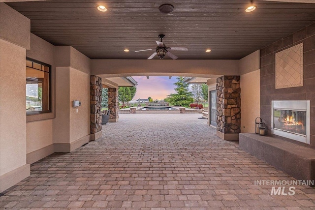 7600 W Ledgerwood Ln, Meridian, ID 83646 - view of patio with ceiling fan and a glass covered fireplace