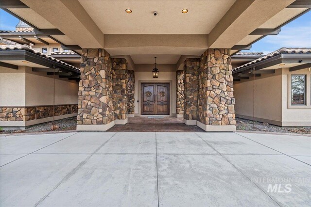 7600 W Ledgerwood Ln, Meridian, ID 83646 - property entrance featuring stucco siding and stone siding