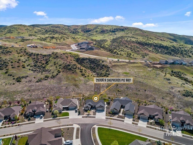 drone / aerial view with a mountain view and a residential view