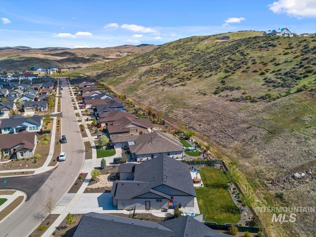 bird's eye view with a residential view and a mountain view