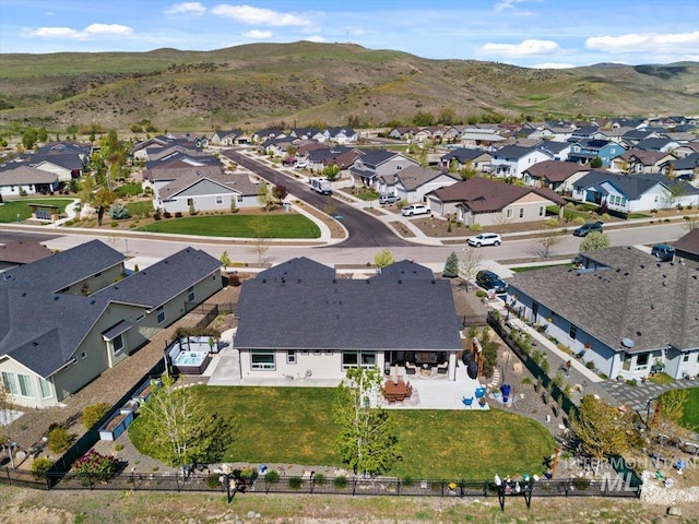 drone / aerial view with a mountain view and a residential view