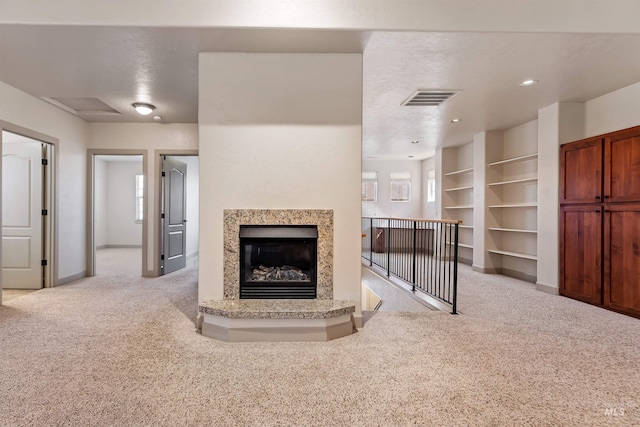 1148 E Winding Creek Dr, Eagle, ID 83616 - unfurnished living room featuring recessed lighting, a fireplace, visible vents, carpet, and baseboards