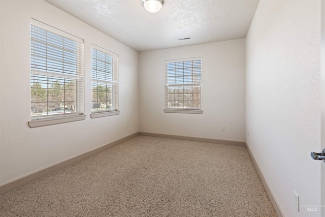 1148 E Winding Creek Dr, Eagle, ID 83616 - carpeted empty room featuring visible vents and baseboards