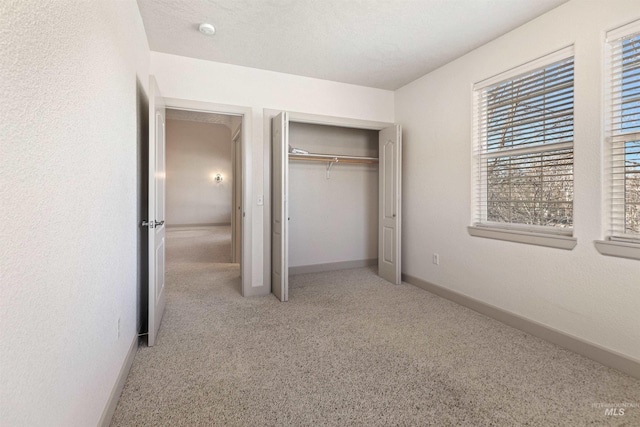 1148 E Winding Creek Dr, Eagle, ID 83616 - unfurnished bedroom with a closet, carpet flooring, and baseboards