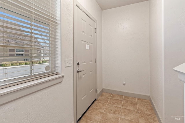 1148 E Winding Creek Dr, Eagle, ID 83616 - entryway featuring a textured wall and baseboards