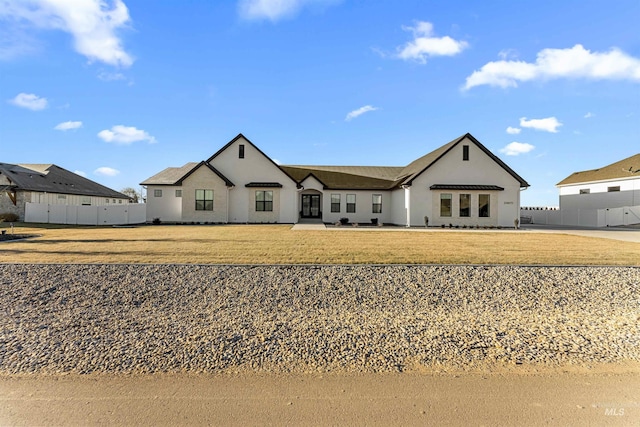 back of house featuring a lawn