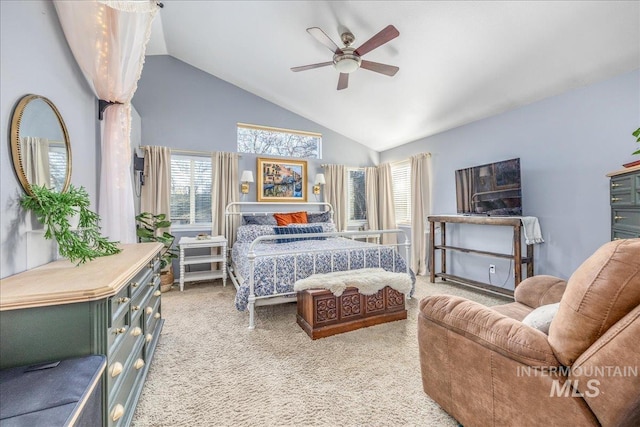 bedroom featuring ceiling fan, lofted ceiling, and light carpet