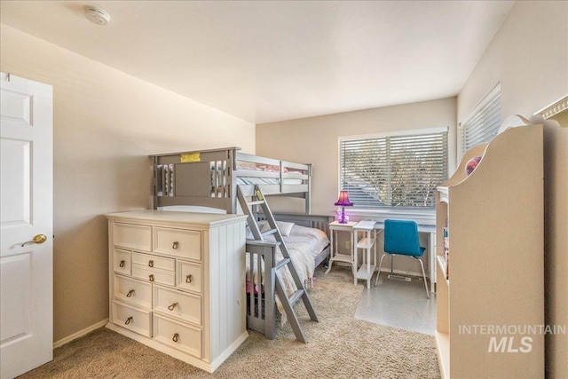 bedroom featuring light carpet