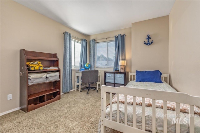 bedroom with baseboards and carpet floors