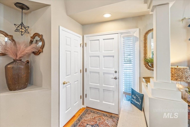 foyer entrance with wood finished floors