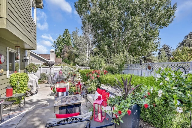 view of patio / terrace featuring a fenced backyard and an outdoor fire pit