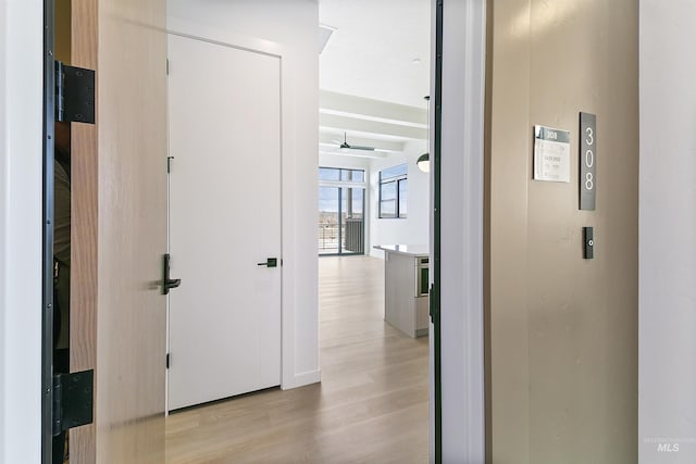 hallway featuring light wood-style floors