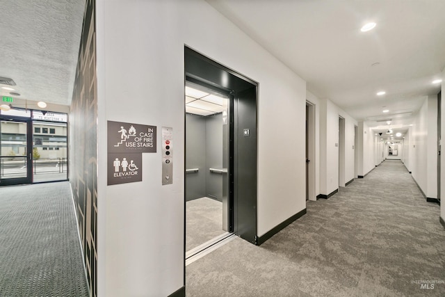 corridor with elevator, baseboards, carpet, and recessed lighting