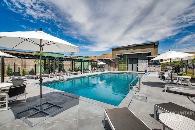 pool with fence and a patio area