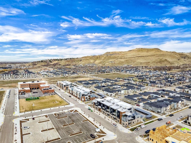 birds eye view of property featuring a mountain view