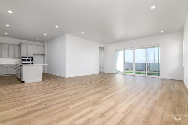 unfurnished living room featuring light hardwood / wood-style flooring