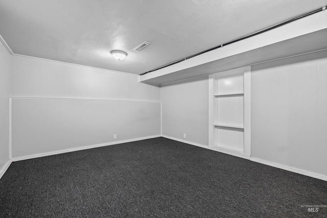 basement featuring carpet flooring