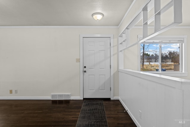 entryway featuring dark hardwood / wood-style floors and ornamental molding