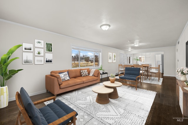 living room with wood-type flooring and ornamental molding