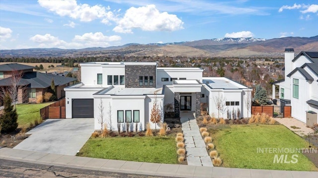 3492 E Heartleaf Dr, Boise, ID 83716 - view of front of home featuring stucco siding, a mountain view, french doors, and fence