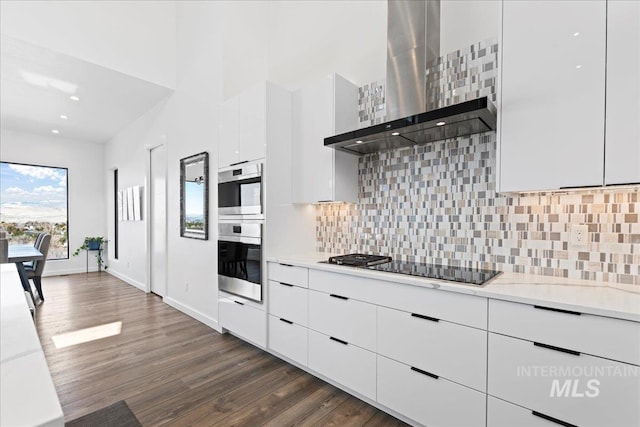 3492 E Heartleaf Dr, Boise, ID 83716 - kitchen featuring black electric cooktop, modern cabinets, wall chimney exhaust hood, and white cabinetry