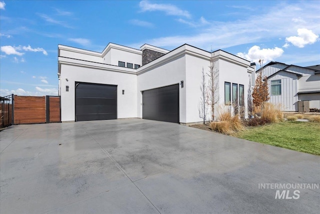 3492 E Heartleaf Dr, Boise, ID 83716 - view of front of home with concrete driveway, fence, a garage, and stucco siding