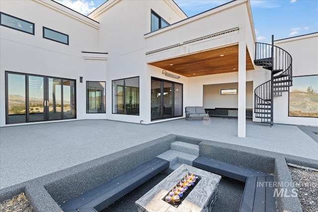 3492 E Heartleaf Dr, Boise, ID 83716 - view of patio / terrace featuring stairway and an outdoor fire pit
