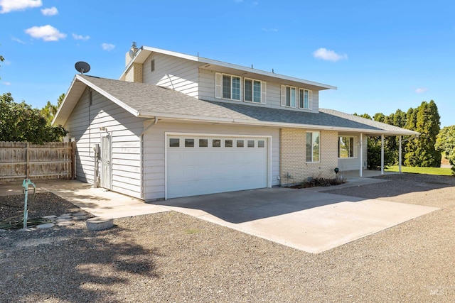 view of front of property with a garage