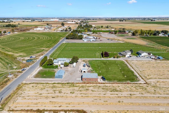 birds eye view of property with a rural view