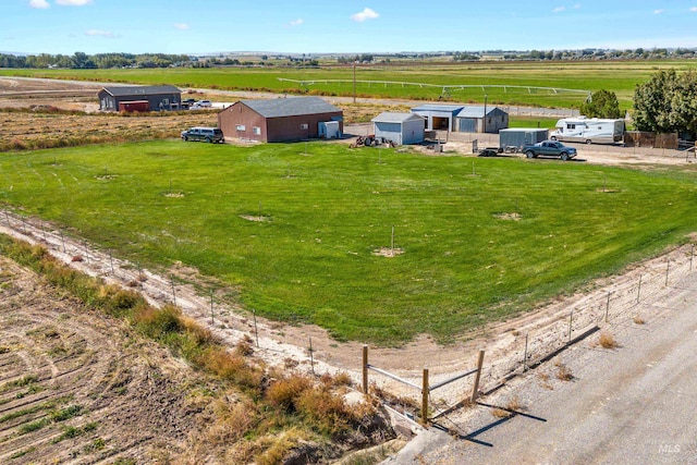 birds eye view of property with a rural view