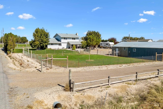 view of yard with a rural view