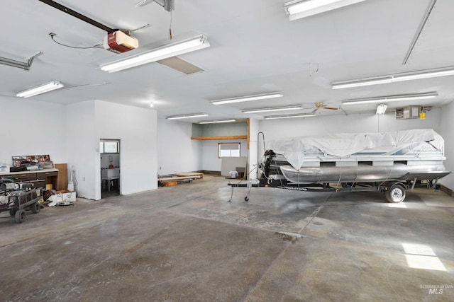 garage featuring a garage door opener and sink