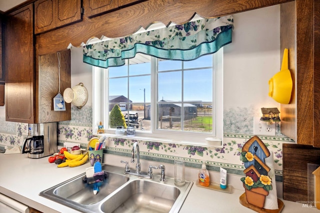 kitchen with plenty of natural light, sink, and tasteful backsplash