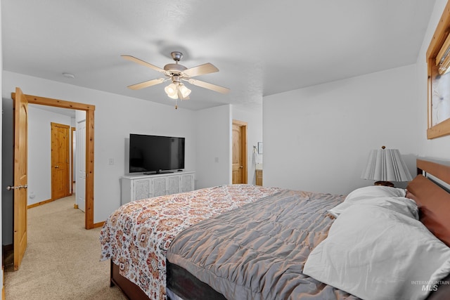 bedroom with ceiling fan and light colored carpet