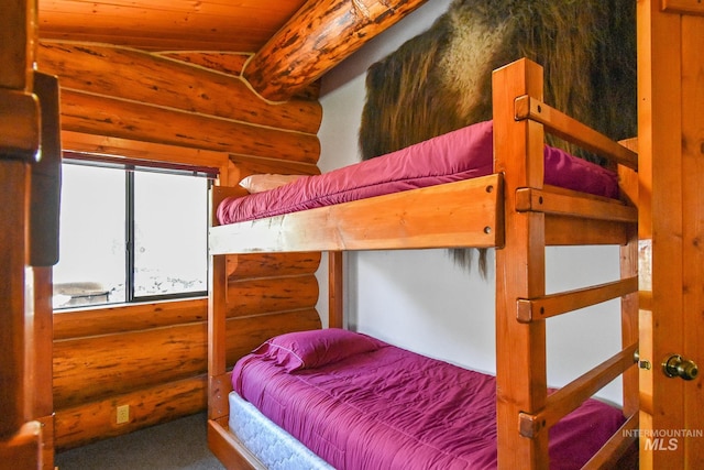 bedroom featuring wood ceiling and vaulted ceiling