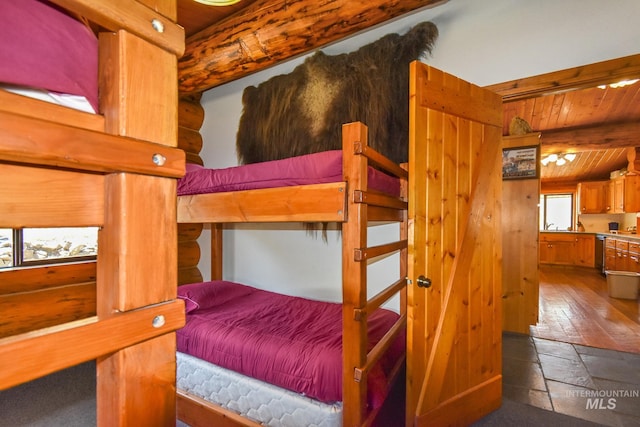 tiled bedroom featuring wooden ceiling and beam ceiling