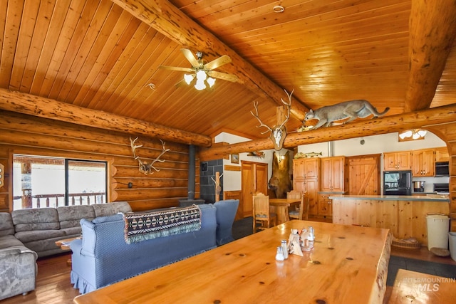 dining area with wood ceiling, rustic walls, and light wood-type flooring