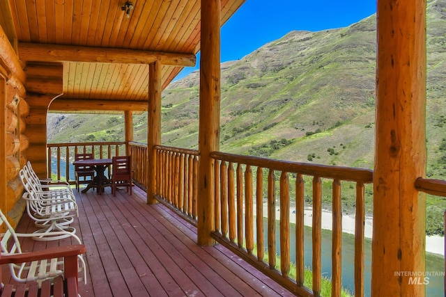 wooden deck featuring a mountain view