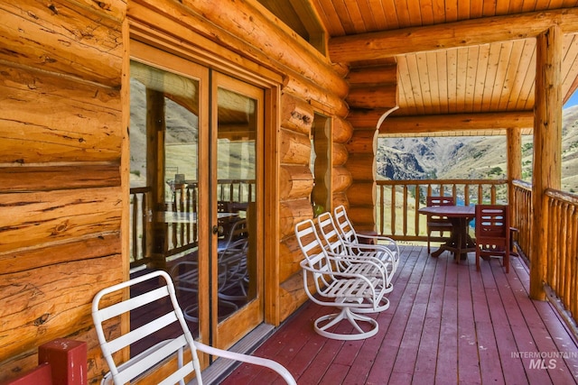 wooden deck featuring french doors