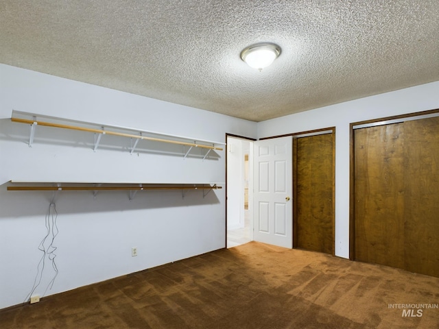 walk in closet featuring carpet