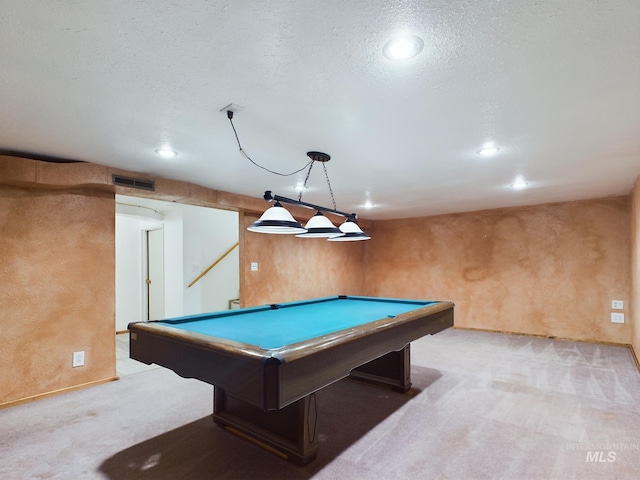 playroom featuring light carpet, a textured ceiling, and billiards