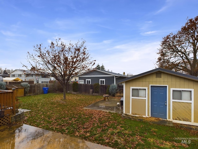 view of yard with a patio area and an outbuilding