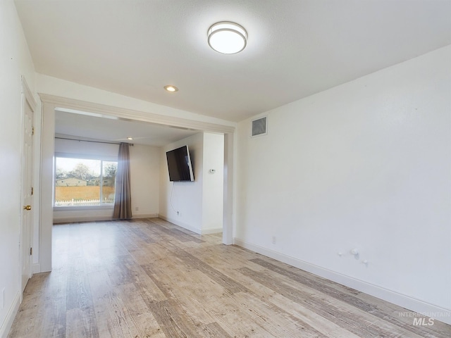 unfurnished room featuring light hardwood / wood-style flooring