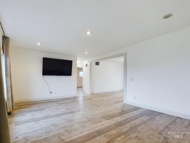 unfurnished living room featuring light hardwood / wood-style flooring