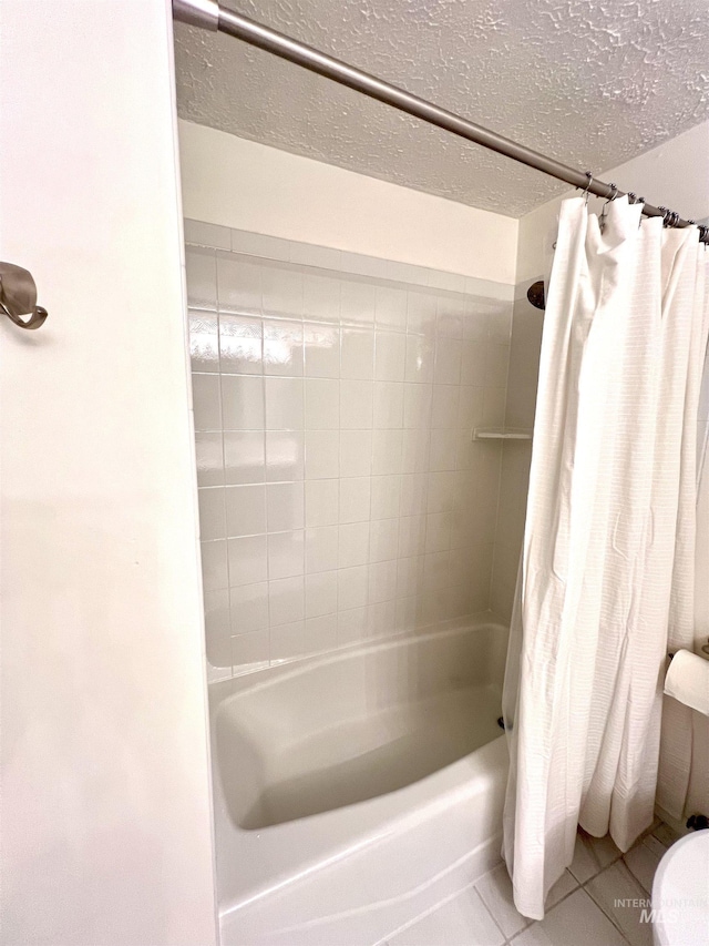1315 W Howard, Boise, ID 83706 - bathroom featuring tile patterned flooring, shower / tub combo, a textured ceiling, and toilet