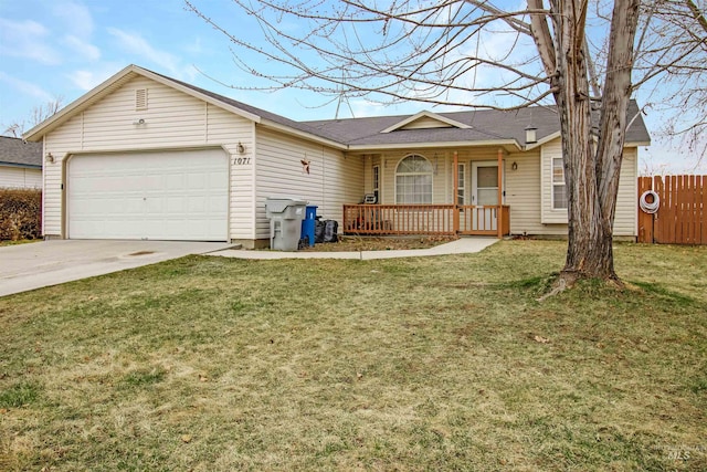 ranch-style house featuring a front lawn, an attached garage, driveway, and fence